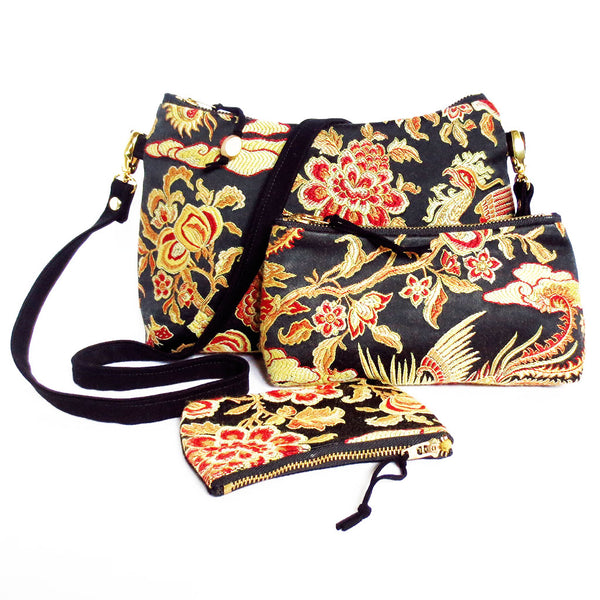 the crossbody bag, the small perfect pouch, and the mini perfect pouch from Holland Cox