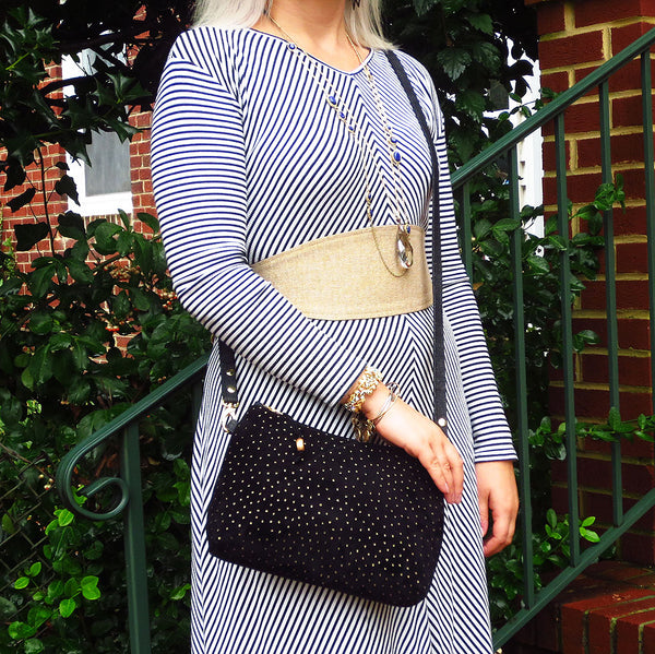 Emily is wearing the calliope crossbody bag and the selina wrap belt