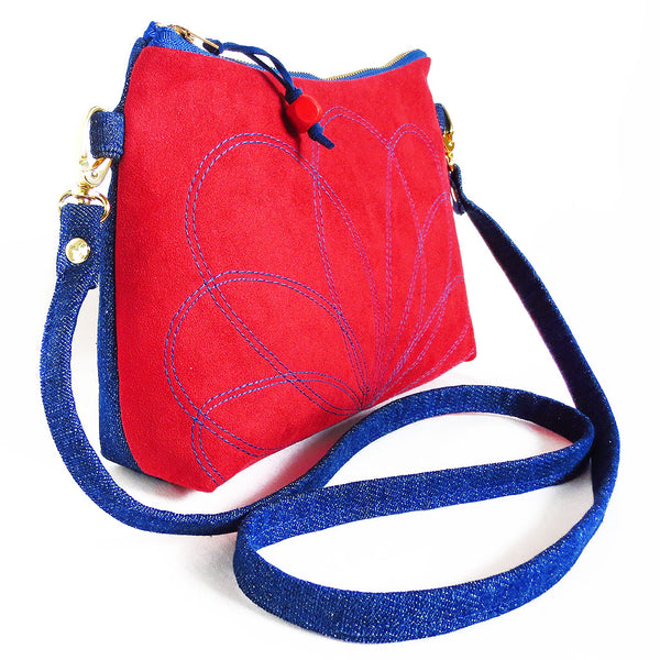 side view of the ultrasude and denim crossbody bag from Holland Cox