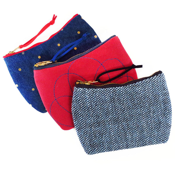 the lola, persephone, and parker mini pouches from Holland Cox