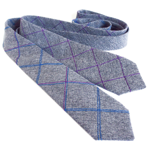 two handmade neckties from Holland Cox in gray wool blend suiting with stitched details in blue and purple