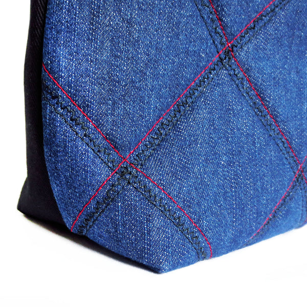 detail of the check motif stitched into the ellington 517 tote
