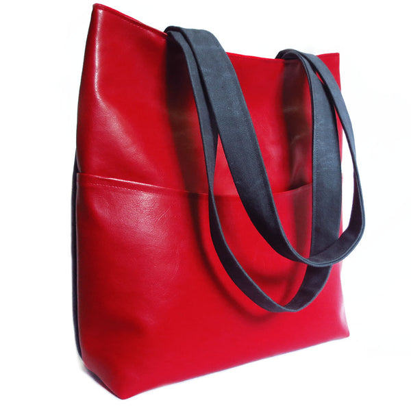 the back of the simone 517 tote is bright red vinyl with a deep pocket