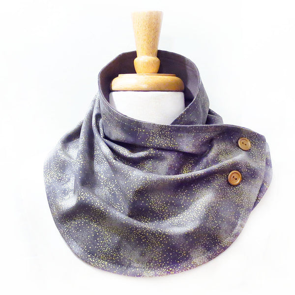 button scarf in subtle print of gold sprinkled on a gray background, lined in gray flannel with two gold hand painted buttons