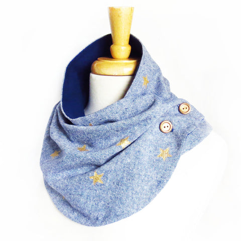 Fabric button scarf in blue essex linen, with small hand painted stars in metallic gold. Lined in navy blue cotton flannel, with hand painted wooden buttons in gold. 
