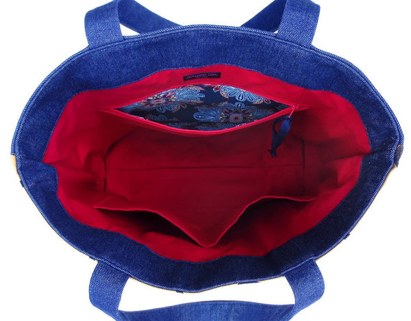 interior of the Cassandra tote, which is fully lined in red twill with three large pockets