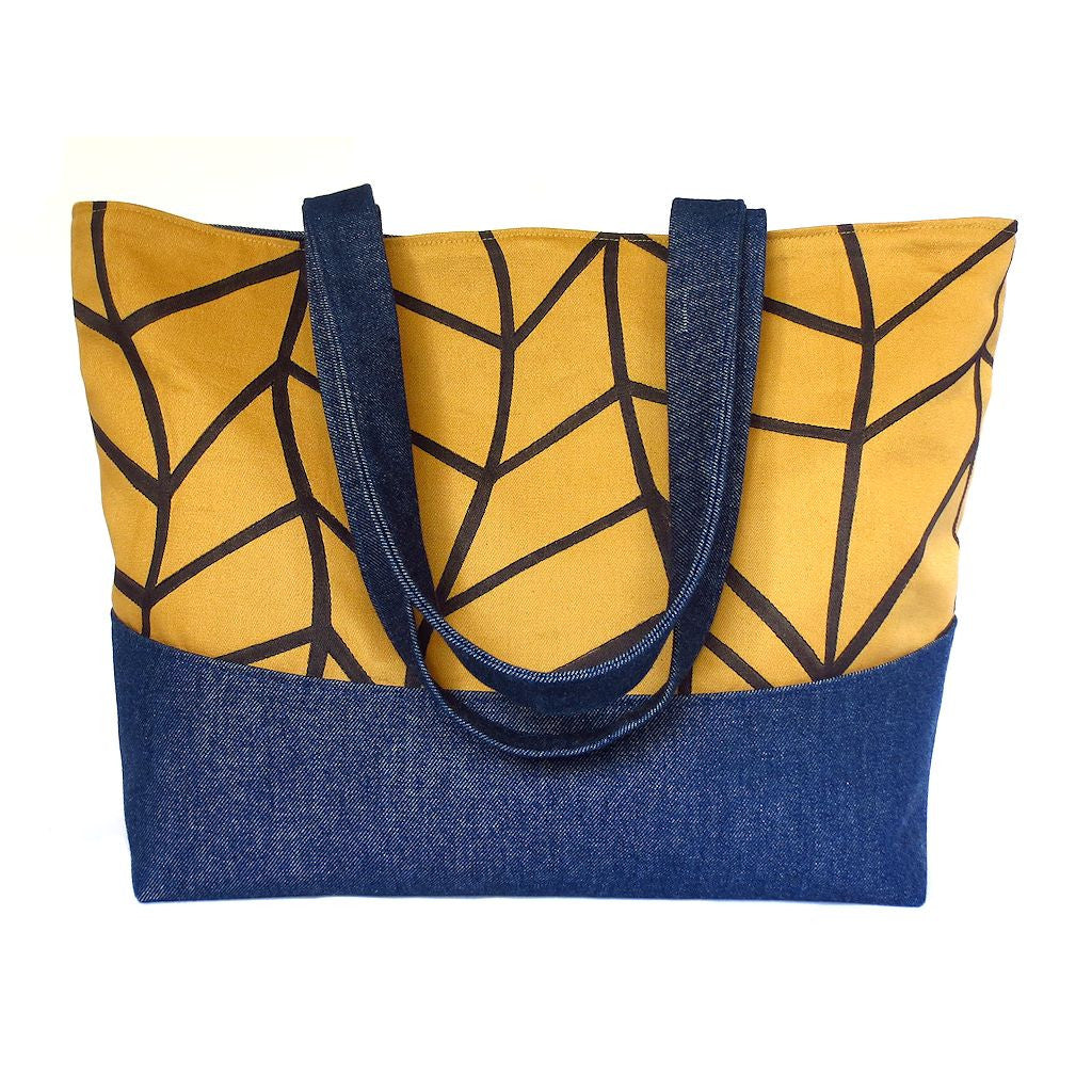 Denim tote bag featuring our signature chevron wave motif, hand drawn in black ink on organic cotton twill