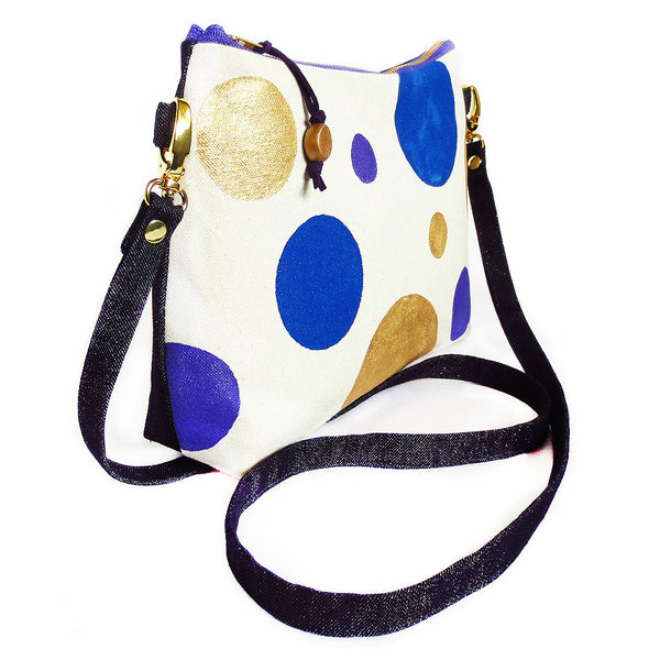 side view of the felicity crossbody bag, showing the two contrasting fabrics