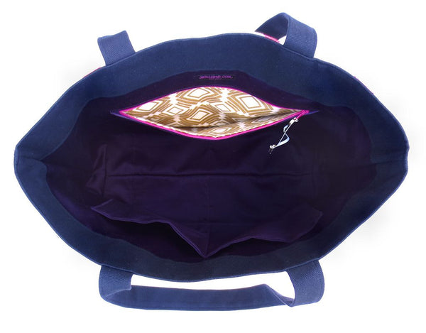 interior of the felicity tote bag, with purple sateen lining and a pocket lined in gold and white abstract print fabric