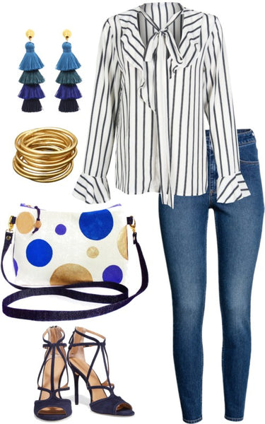outfit idea for the felicity crossbody bag, featuring a striped blouse, skinny jeans, and tassel earrings