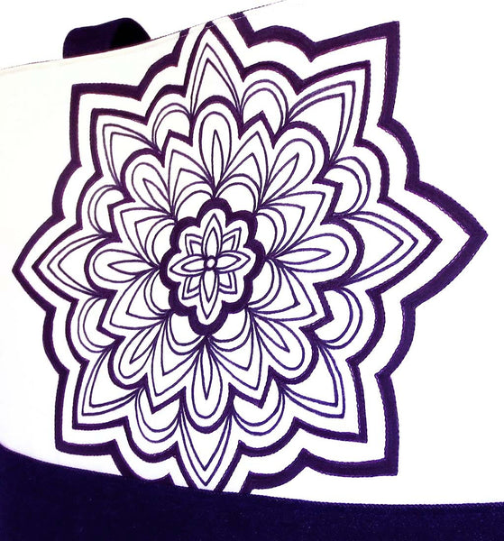 hand drawn mandala motif in black ink on off white fabric