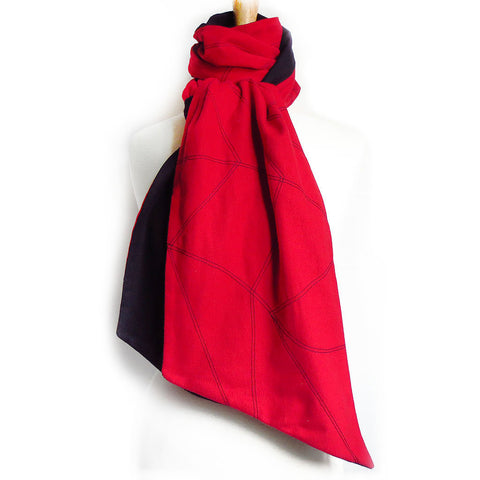 red and black flannel scarf stitched with chevron wave motif in black.