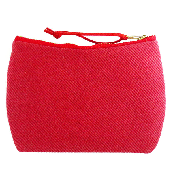 the back of the lola mini pouch is red denim
