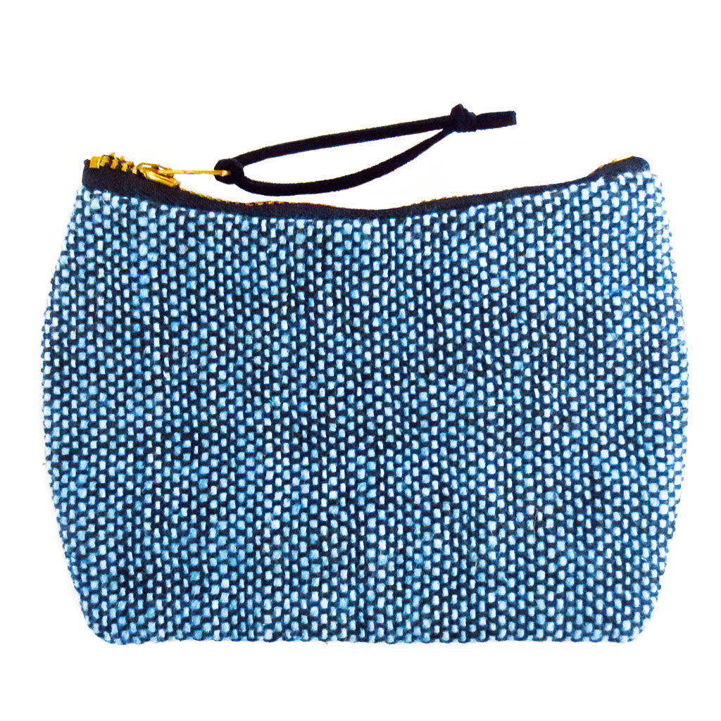 the parker mini pouch is blue and black cotton tweed