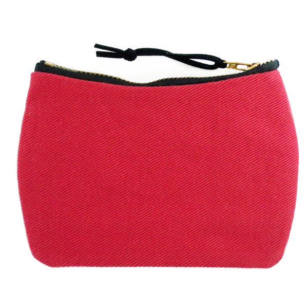 the back of the simone mini pouch is red denim
