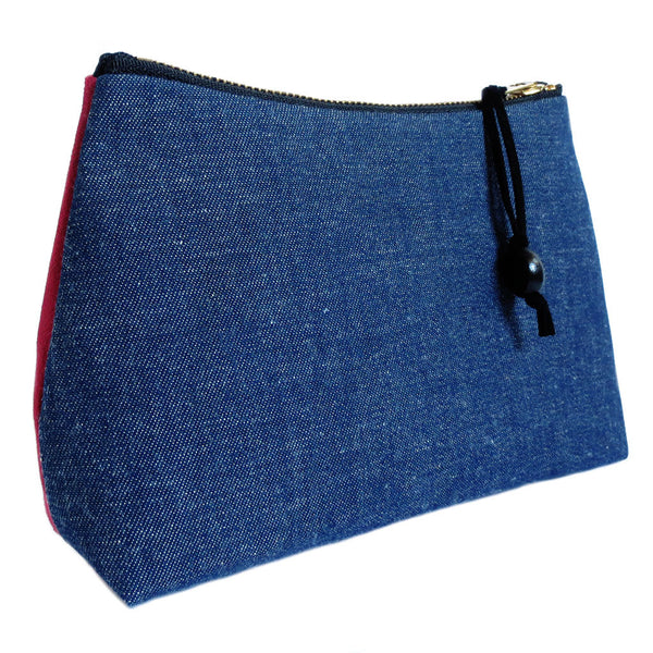 the back of the persephone zip pouch is vintage dark blue denim