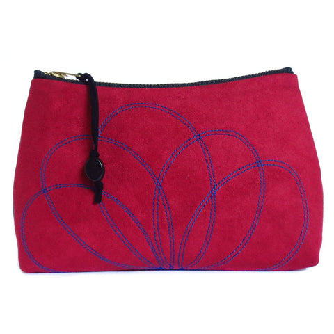 red ultrasuede zip pouch with stitched petal motif, from Holland Cox