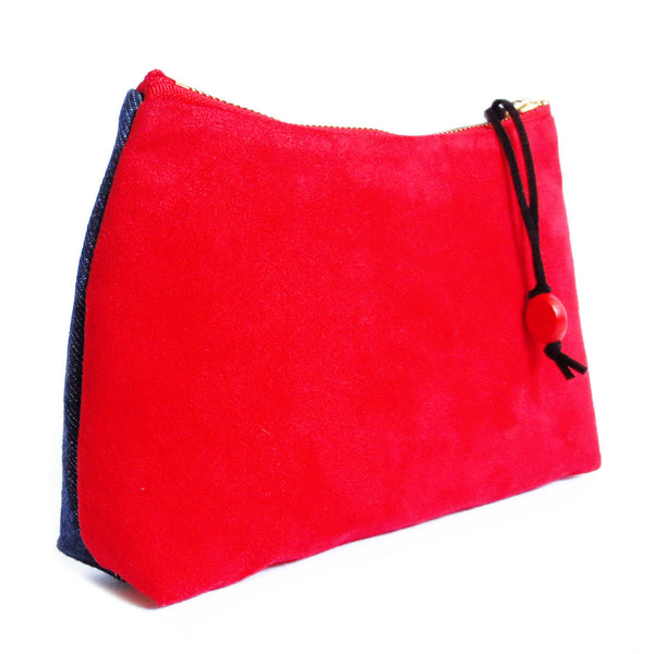 the back of the simone zip pouch is bright red ultra suede