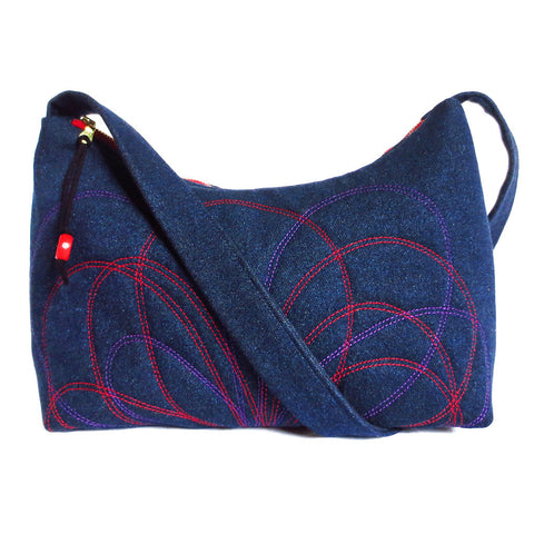 denim handbag with petal motif stitched in red and purple