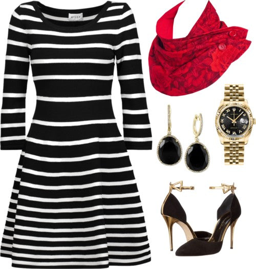 the rosetta scarf styled with a black and white striped dress, black heels, and black and gold jewelry