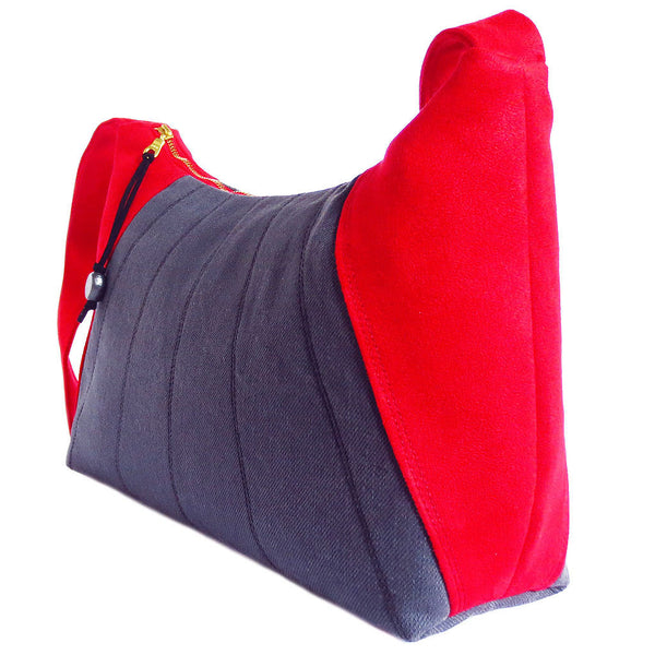 side view of the sibyl everyday bag, showing off the bright red ultrasuede