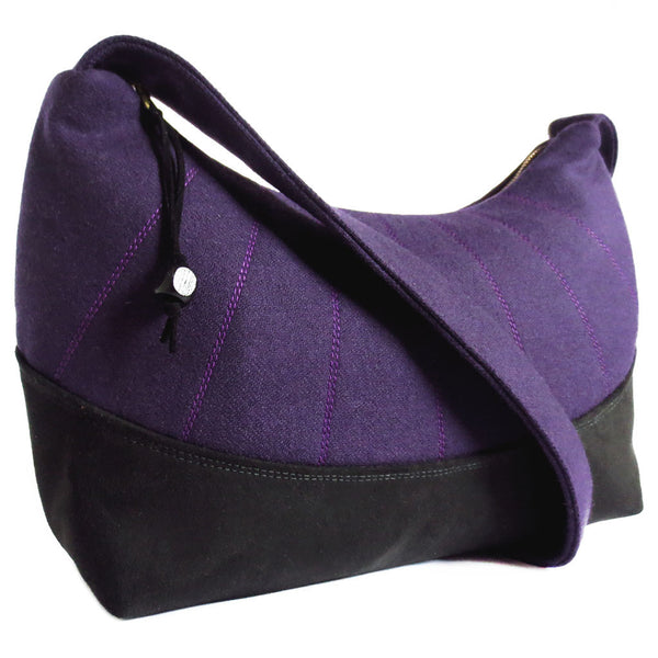 the simone everyday bag features purple wool with stitching details and black ultrasuede