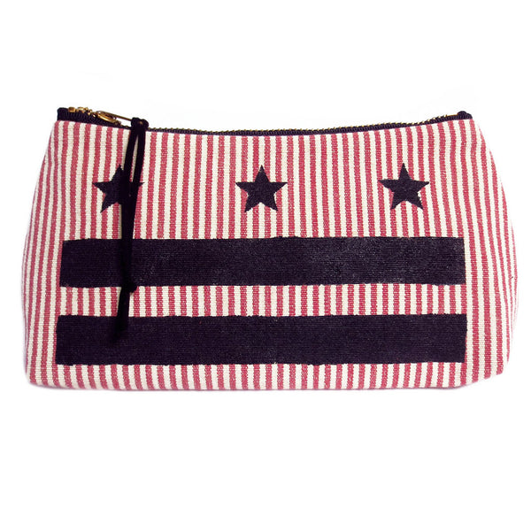 small pouch from Holland Cox featuring the stars and bars of the DC flag painted in black on vintage red and white ticking