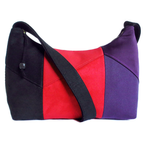 The trinity everyday bag from Holland Cox, in black, red, and purple